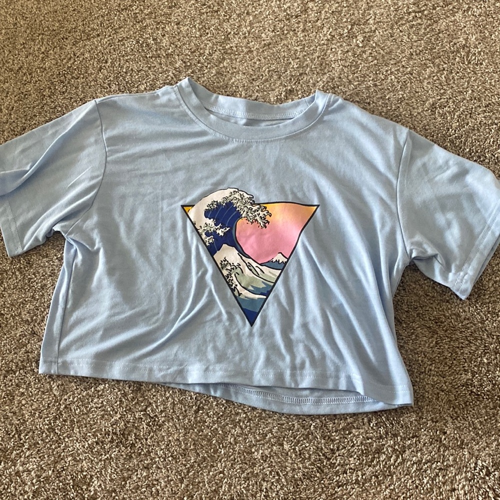 sunset wave design on blue cropped tee